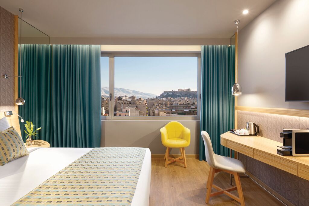 Chambre double exectutive avec vue sur l'Acropole de Wyndham Grand Athens Hôtel 5étoiles situé proche du centre d'Athènes capitale de la Grèce
